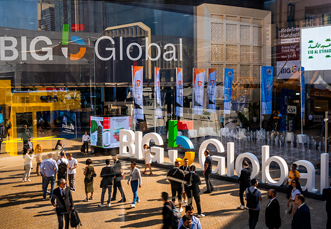 Attendees moving through a Big 5 Global branded event entrance.